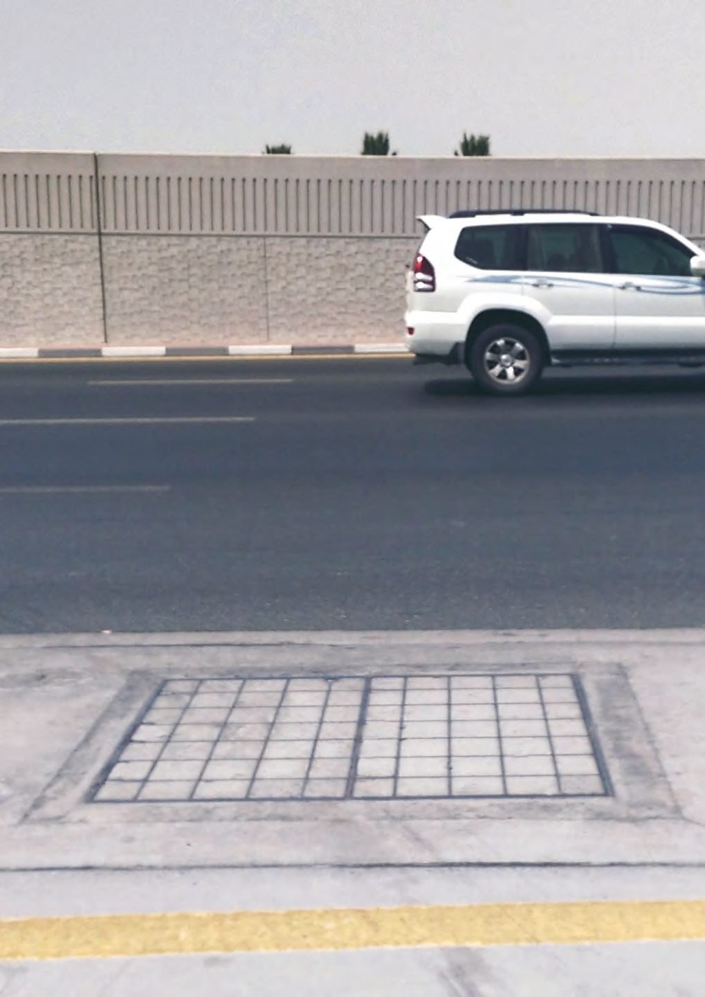 Concrete infill pumping station cover set into a road